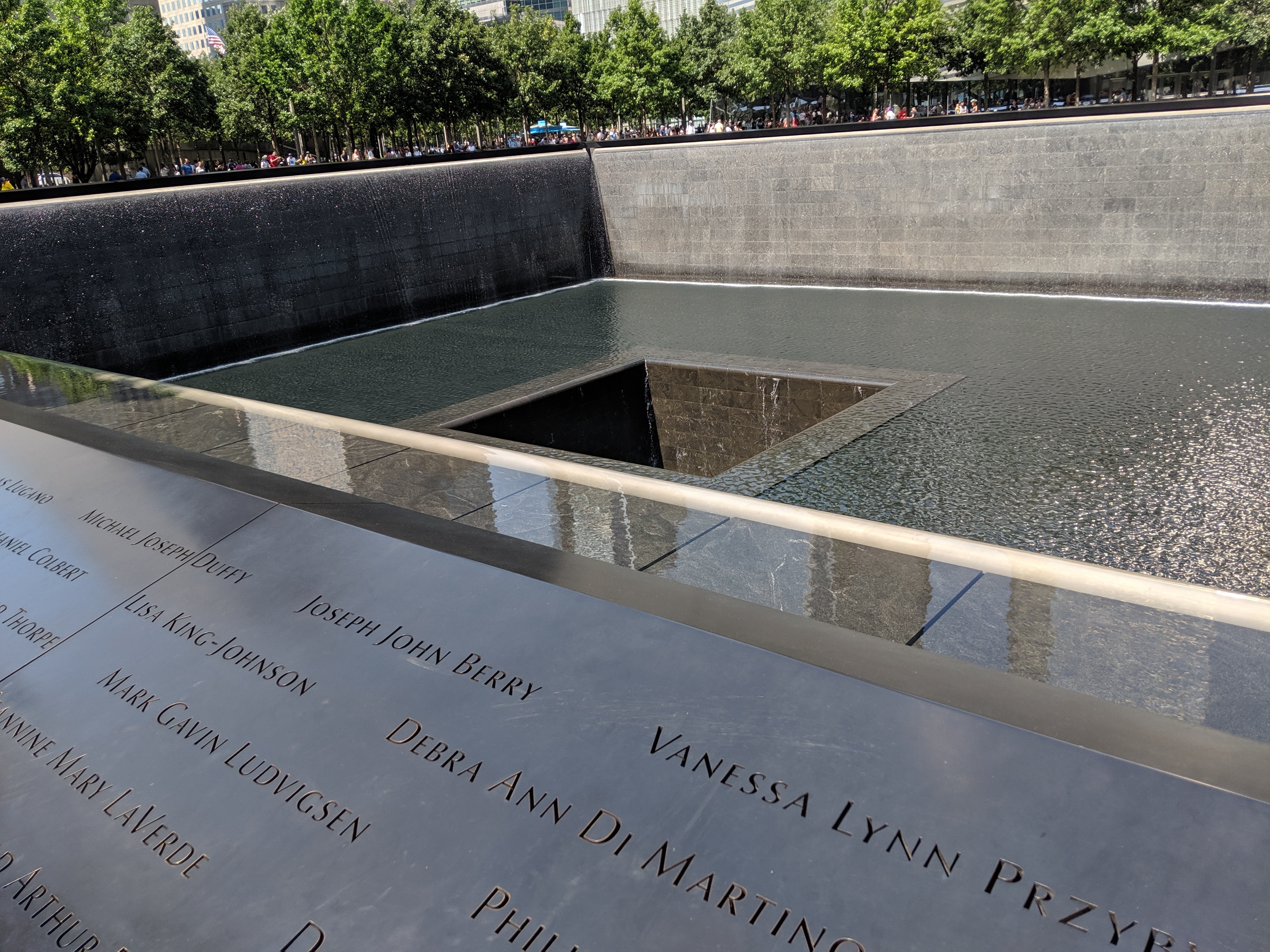 (c) Kathleen Thompson. 9/11 Memorial. Loves ones leave yellow roses.